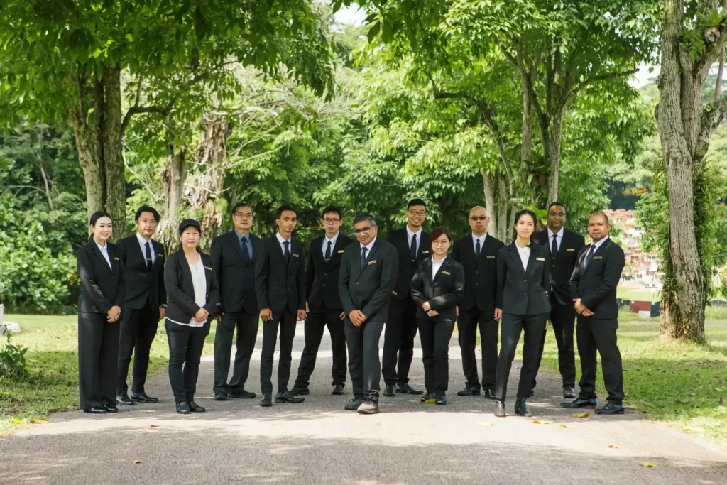 Men and women in black suits for Amazing Grace